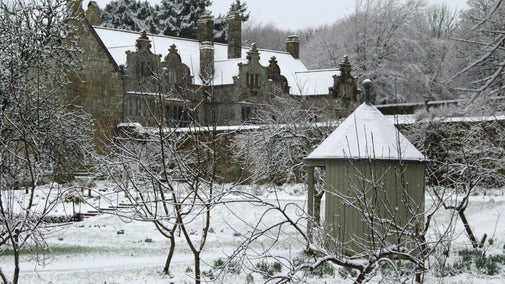 An image of Trerice covered in snow, taken from the orchard, Trerice, Cornwall